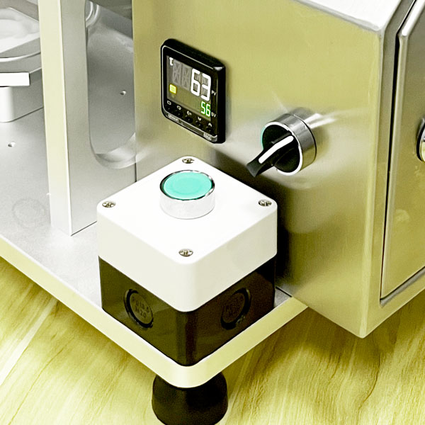 Separated activation button on laboratory pod machine